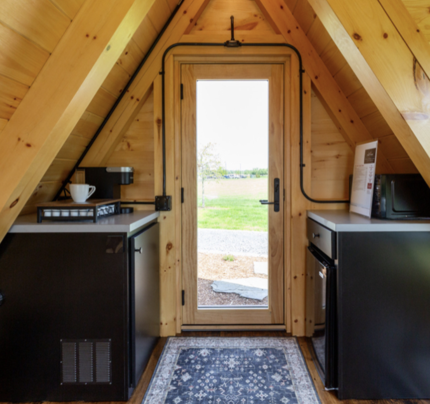 Pine A-frame interior with kitchenette