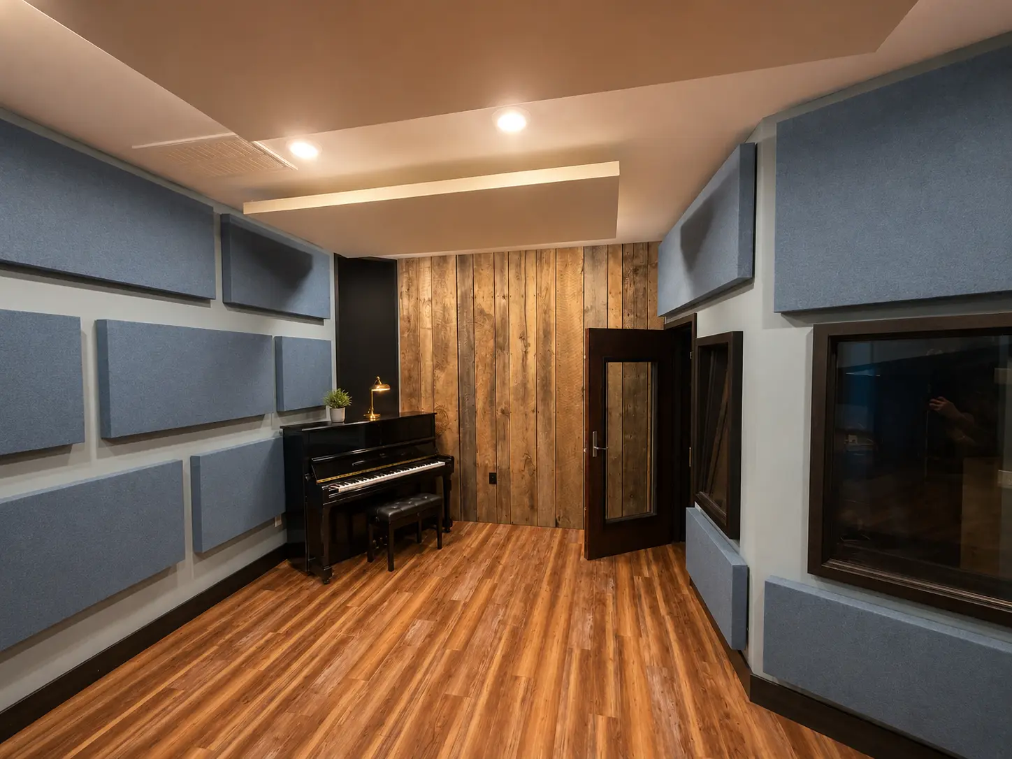 Live room with grand piano, vintage amps and vaulted reclaimed wood ceiling