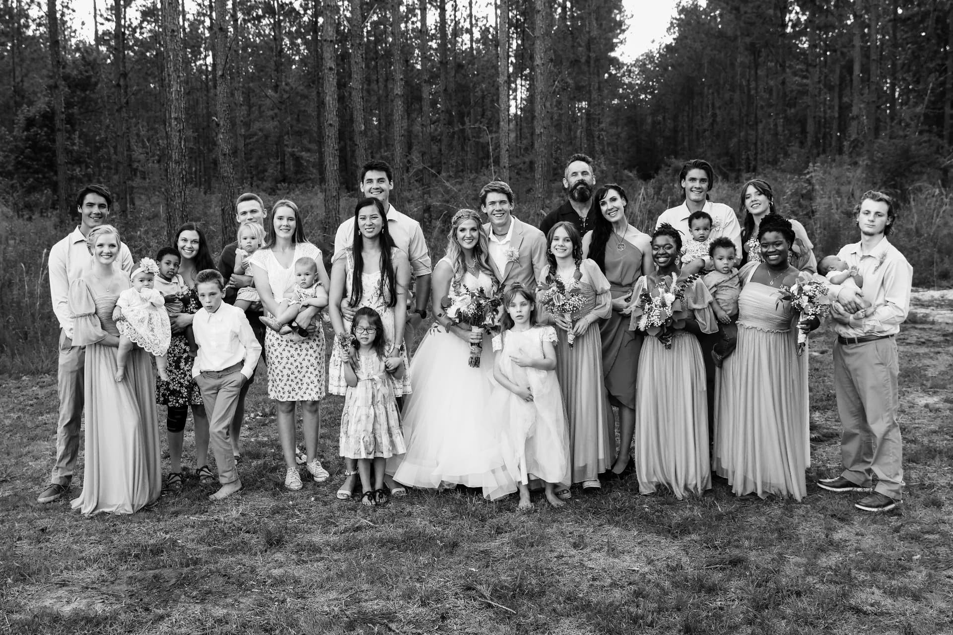 The Allison family gathered together in the pines at Refuge Ridge Ranch